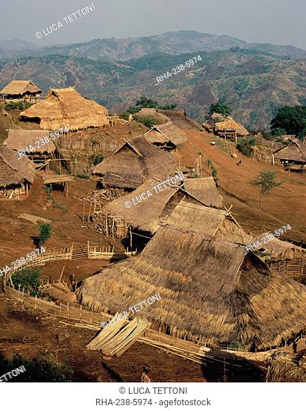 Akha hill tribe village, with deforested hills destroyed by slash and burn farming by tribes in the background, Chiang Rai province, Thailand, Southeast Asia