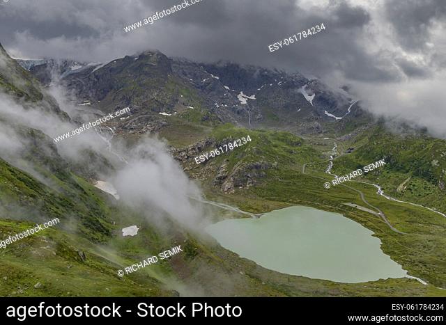 Typical alpine landscape of Swiss Alps with Steinsee, Urner Alps, Canton of Bern, Switzerland