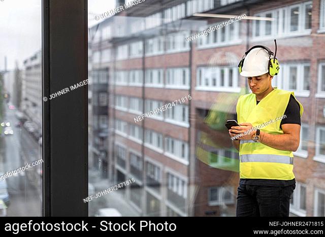Worker using cell phone
