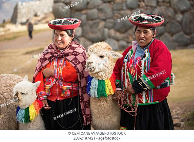 Quechua-Peruvian women with traditional costume and llamas near Cusco, Saqsaywaman, Cusco, Peru, South America