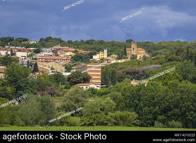 Village of Santa EulÃ lia de Ronçana, surrounded by green fields and clouds in spring (Vallès Oriental, Barcelona, Catalonia, Spain)