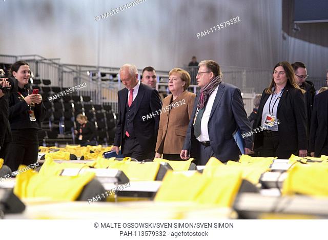 Angela MERKEL, Federal Chancellor and CDU Chair, Klaus SCHUELER, SchÃ- ller, CDU Bundesgeschaeftsfuehrer, visit the plenary hall, hall tour, Messe Hamburg, 06