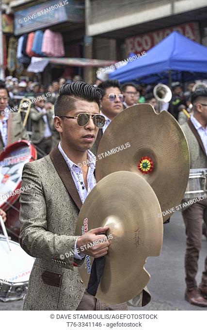 Marching band member with cymbals at the Gran Poder Festival, La Paz, Bolivia