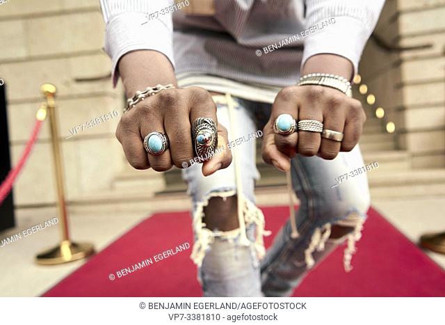 jewelry rings on hand of famous celebrity on red carpet
