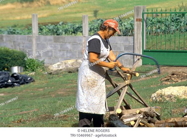 Estrada Galicia Spain Santuario De Milagres Woman Sawing Wood
