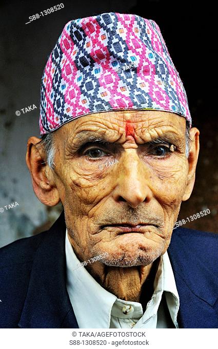 Mepali old man with traditional hat