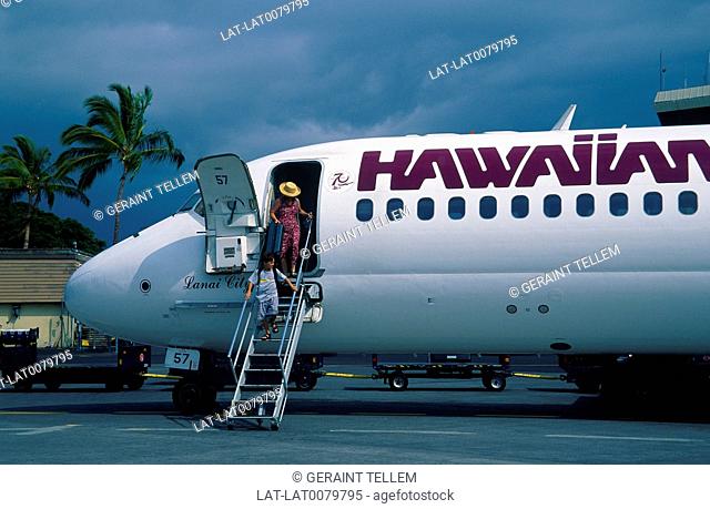 Kona Airport. Hawaiian islands plane. On runway. Person on steps