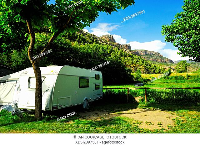 caravan and view of Pyrenees Mountains from Camping Collegats, La Pobla de Segur, Llieda Province, Catalonia, Spain