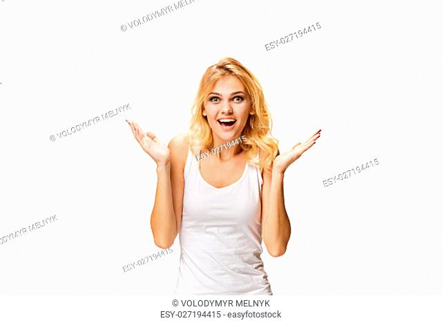 The young woman's portrait with happy emotions on white studio background