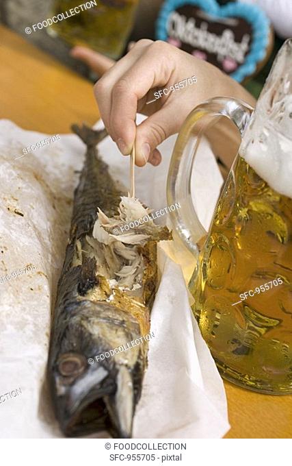 Steckerlfisch fish on stick, litre of beer Oktoberfest, Munich