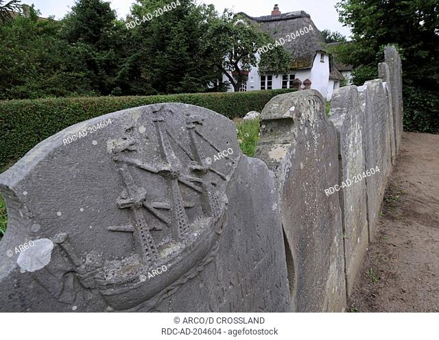 Speaking stones, headstones cemetery, graves of sandstone, near St Clemens church, Nebel, Amrum, Schleswig-Holstein, Germany