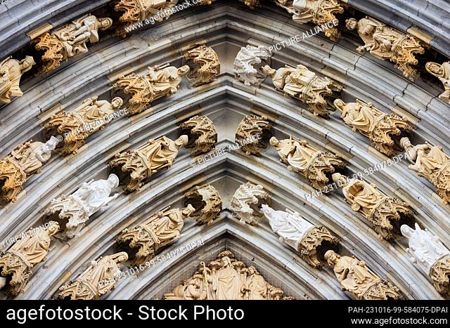 16 October 2023, North Rhine-Westphalia, Cologne: The archivolts and the tympanum from the St. Michael's portal at Cologne Cathedral can be seen again without...