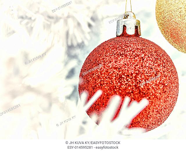 Red and golden balls decorates the white christmas tree - vintage tinted