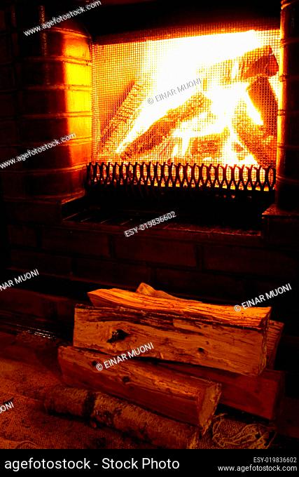 Foto of warm fireplace at late evening