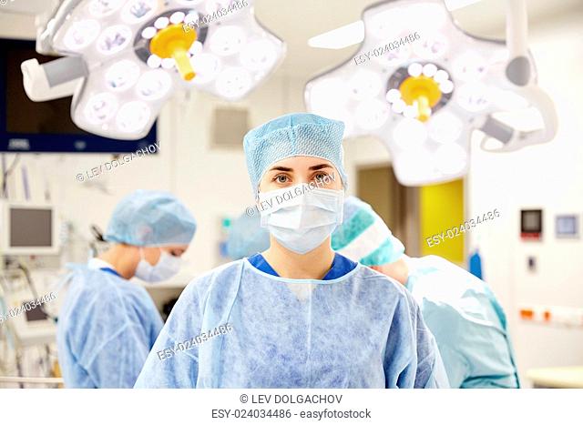 surgery, medicine and people concept - surgeon in operating room at hospital