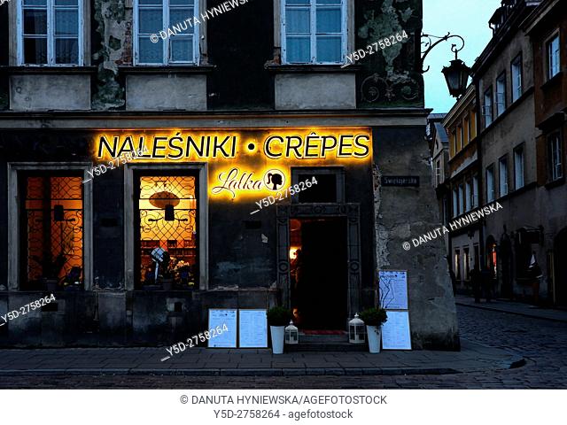 Charming neon of traditional creperie (nalesniki) restaurant, Swietojerska street near Freta street, New Town, Warsaw, Poland, Europe