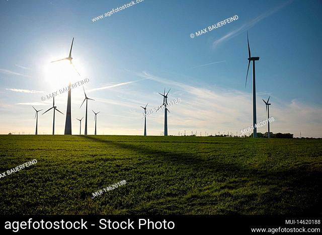 Wind turbine on a field in autumn in the evening