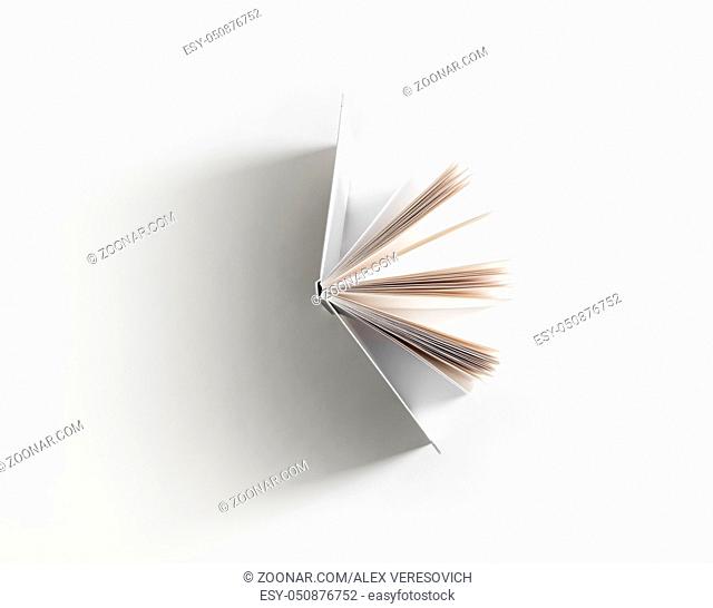 Open book with soft shadow on white paper background