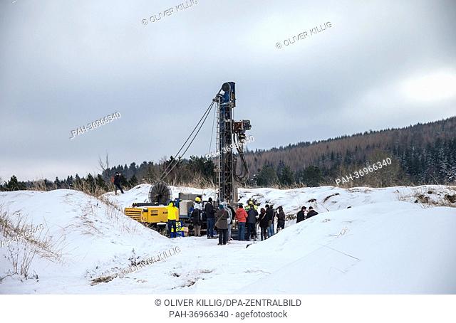 Workers prepare a drill head to drill for samples at a mine dump in Altenberg,  Germany, 11 February 2013. The Helmholtz Research Center in Dresden and the...
