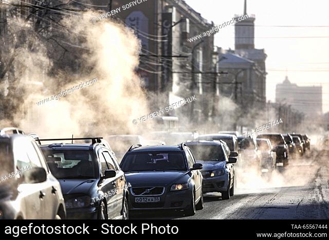 RUSSIA, OMSK - DECEMBER 8, 2023: Cars move along the street in the Siberian city of Omsk on a frosty winter day. According to Russia's weather forecasting...