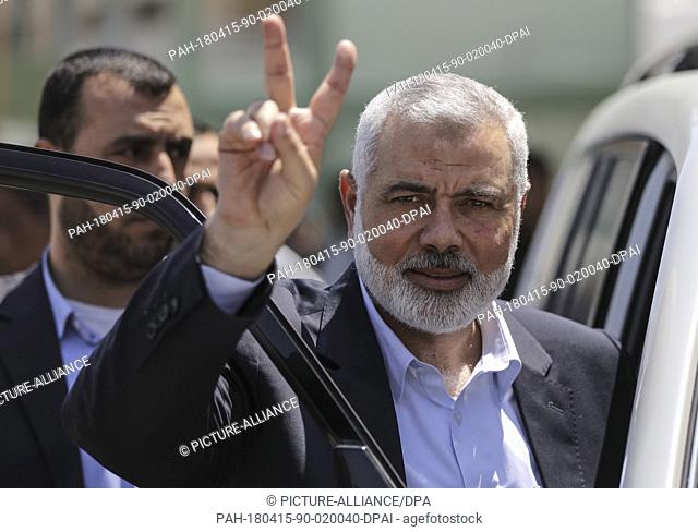 Chairman of the political bureau of the Islamist Palestinian Hamas movement Ismail Haniyeh flashes the victory sign during the funeral of Islamic Jihad...