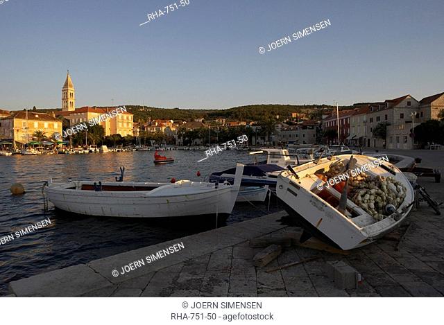 Evening light in Supetar, with fishing boats in foreground, Brac, Dalmatian Coast, Croatia, Europe