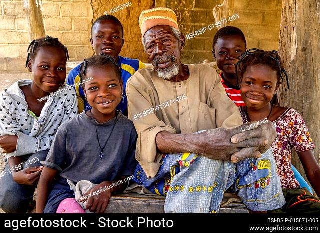 Children around their grandfather in Tenkodogo, Burkina Faso