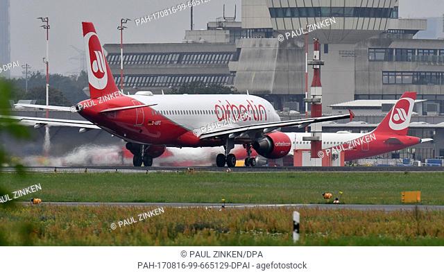 dpatop - An Air Berlin plane taxiing to a runway in the rain at Tegel Airport in Berlin, Germany, 16Â August 2017. The airline filed for insolvency on 15 August