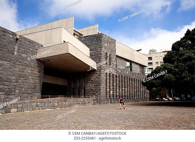 Man in front of a modern building in town center, Santa Cruz de Tenerife, Tenerife, Canary Islands, Spain, Europe