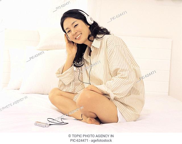 Young Woman Listening to the Music, Korea