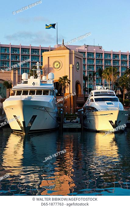 Bahamas, New Providence Island, Nassau, Paradise Island, Atlantis Hotel and Casino, Marina Village, yacht, dusk
