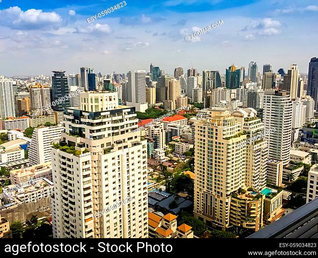 Skyline of big city full of skyscrapers in the business district of Bangkok, view from condominium in Petchburi Road