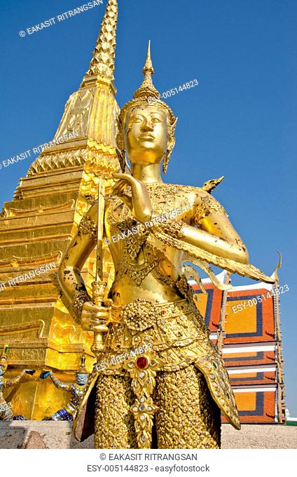 A Golden Kinnari statue at the Temple of the Emerald Buddha Wat Phra Kaew , Bangkok, Thailand