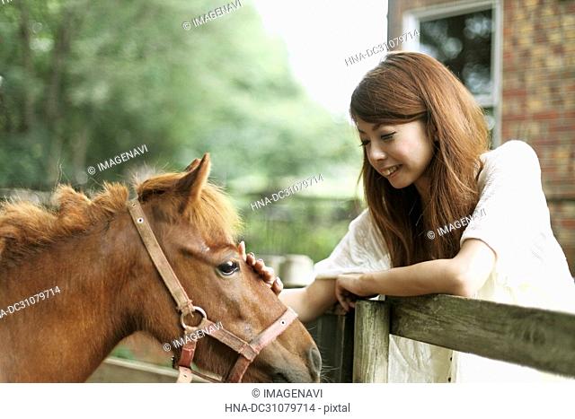 Young woman and a horse