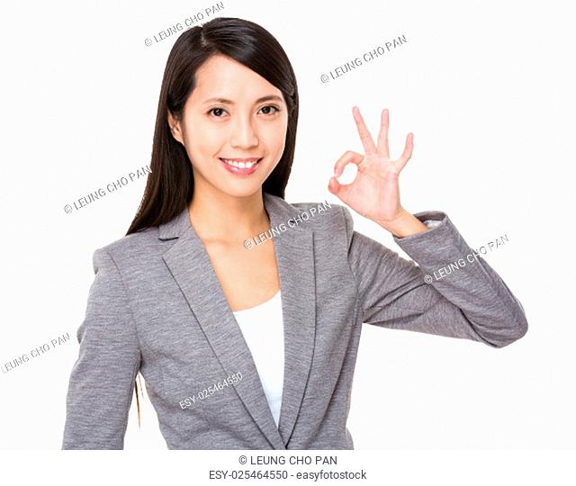 Businesswoman with ok gesture