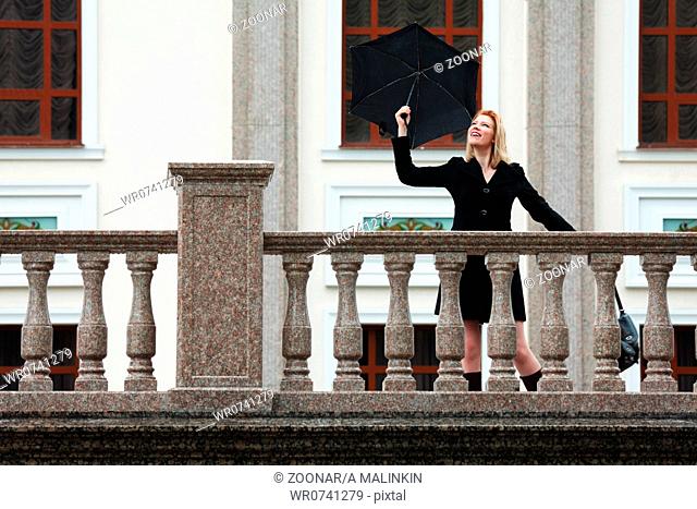 Happy woman with umbrella