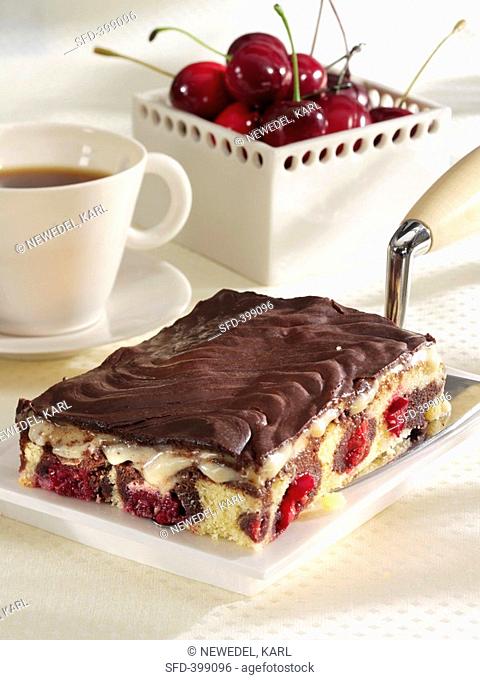 Danube Waves Cake on cake slice, cup of coffee