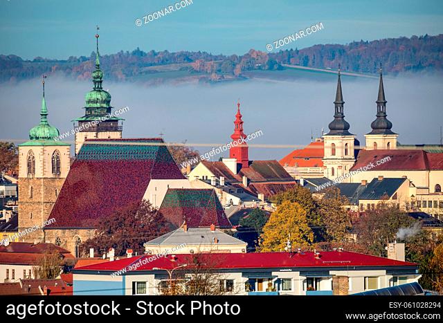 view of the city of Jihlava with Church of St. James the Greater. Autumn fall season with mist. Vysocina, Czech Republic