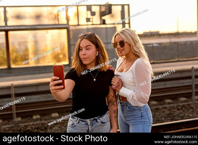 Female friends taking selfie