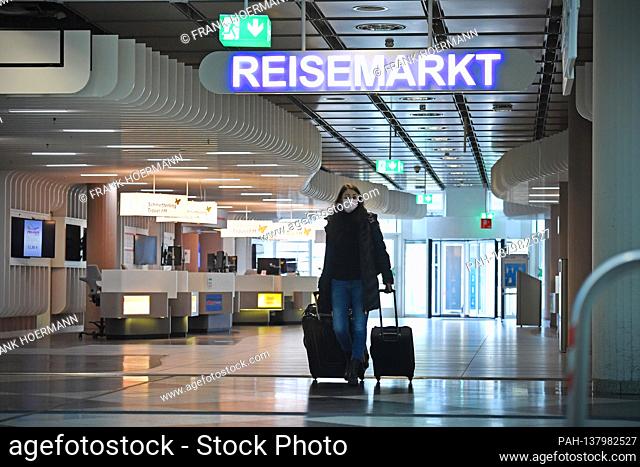 Topic picture coronavirus pandemic consequences for the tourism industry. Check Point Reisen, travel agency at Franz Josef Strauss Airport in Munich