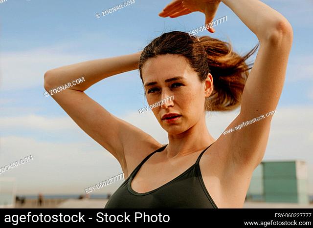 Outdoor portrait of sporty young woman. High quality photo