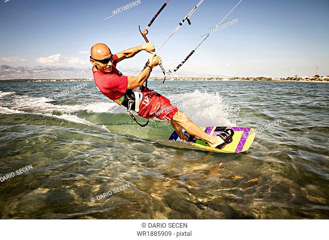 Croatia, Man kite surfing at high speed