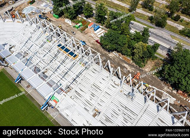 View of the roof and the roof construction of the versus straight when converting the game park stadium. Drone shot of construction site at Wildparkstadion...