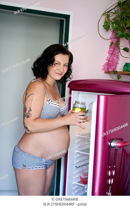 Pregnant woman with pickles