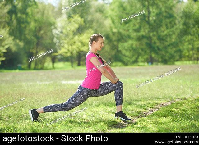 Young woman doing fitness exercises, Bavaria, Germany, Europe