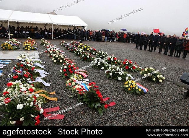 16 April 2023, Thuringia, Weimar: Wreaths lie on the former Appelplatz during a commemoration of the 78th anniversary of the liberation of Buchenwald...