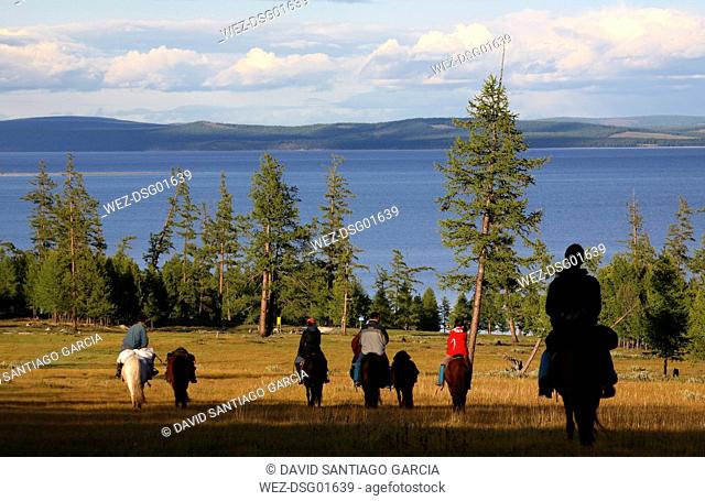 Mongolia, Lake Khovsgol National Park, Sayan Mountains, Tourists riding at Lake Khovsgol