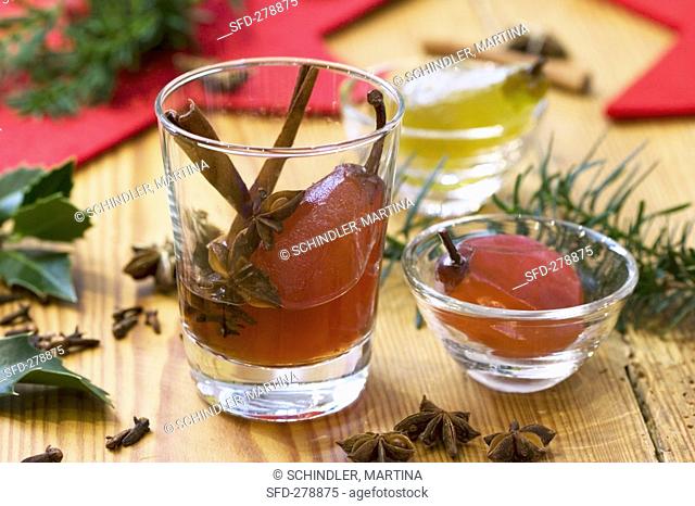 Candied pears with cinnamon sticks in port wine