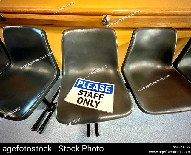 Chairs with a please staff only sign