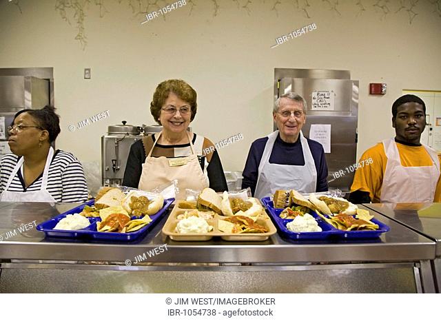 Volunteers serve lunch at the Capuchin soup kitchen, Detroit, Michigan, USA